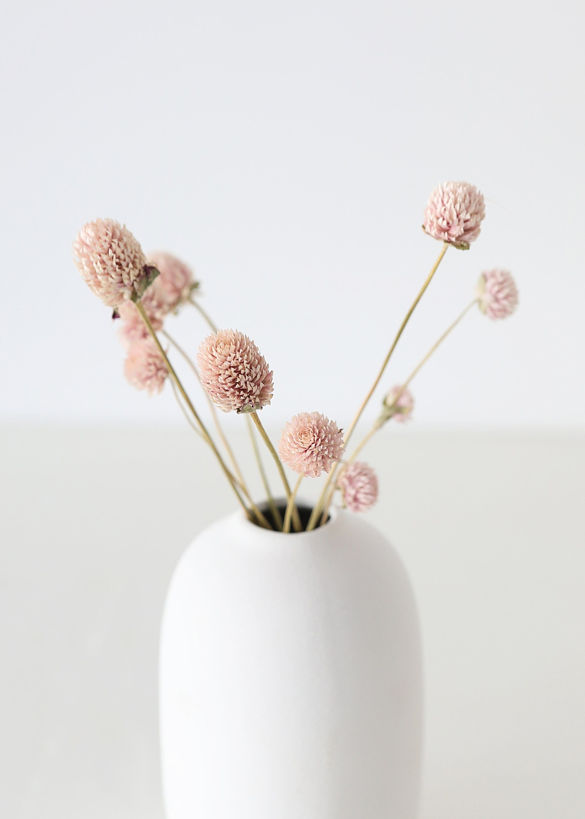 Pink preserved-style botanicals for wedding decor