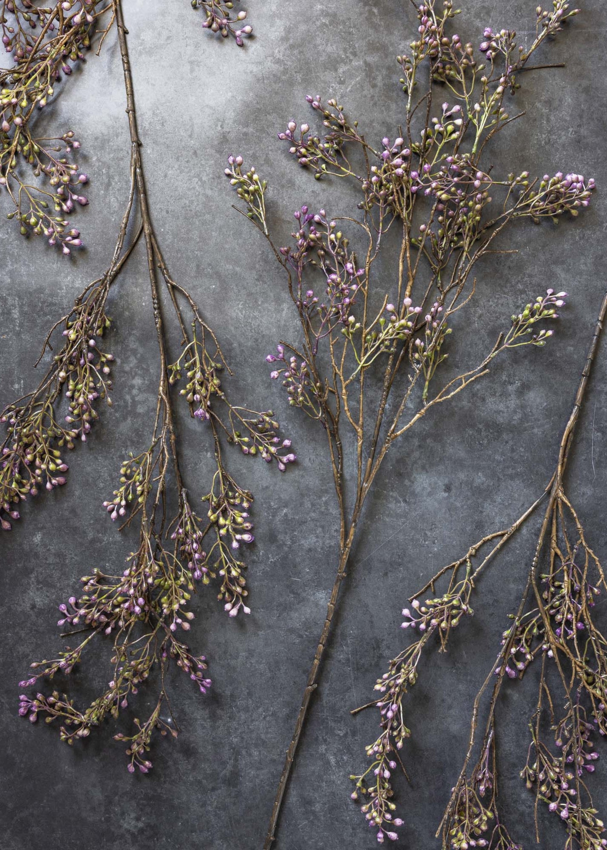 Tall faux berry stem styled in statement vase