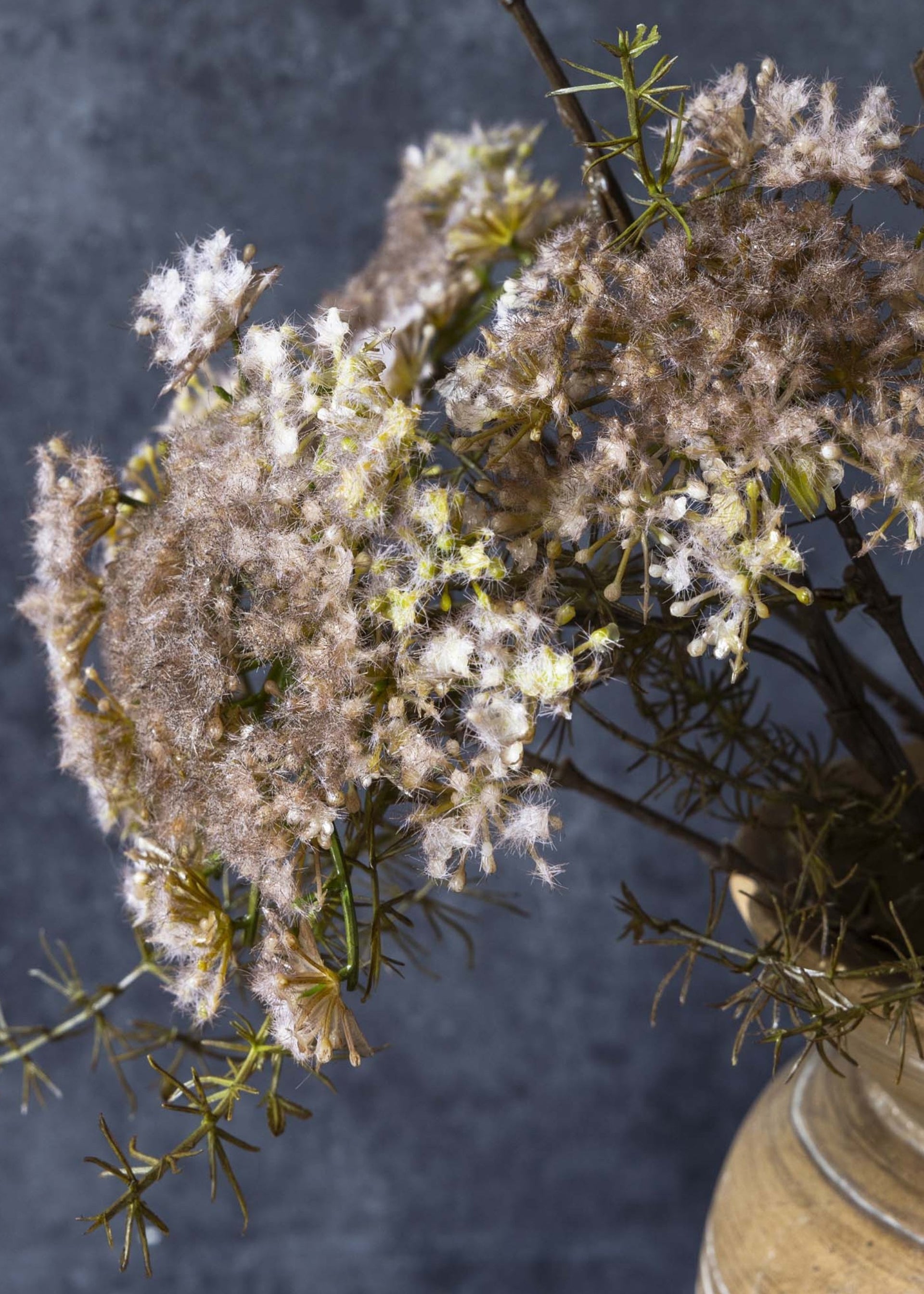 Blush faux flower branch styled in statement vase