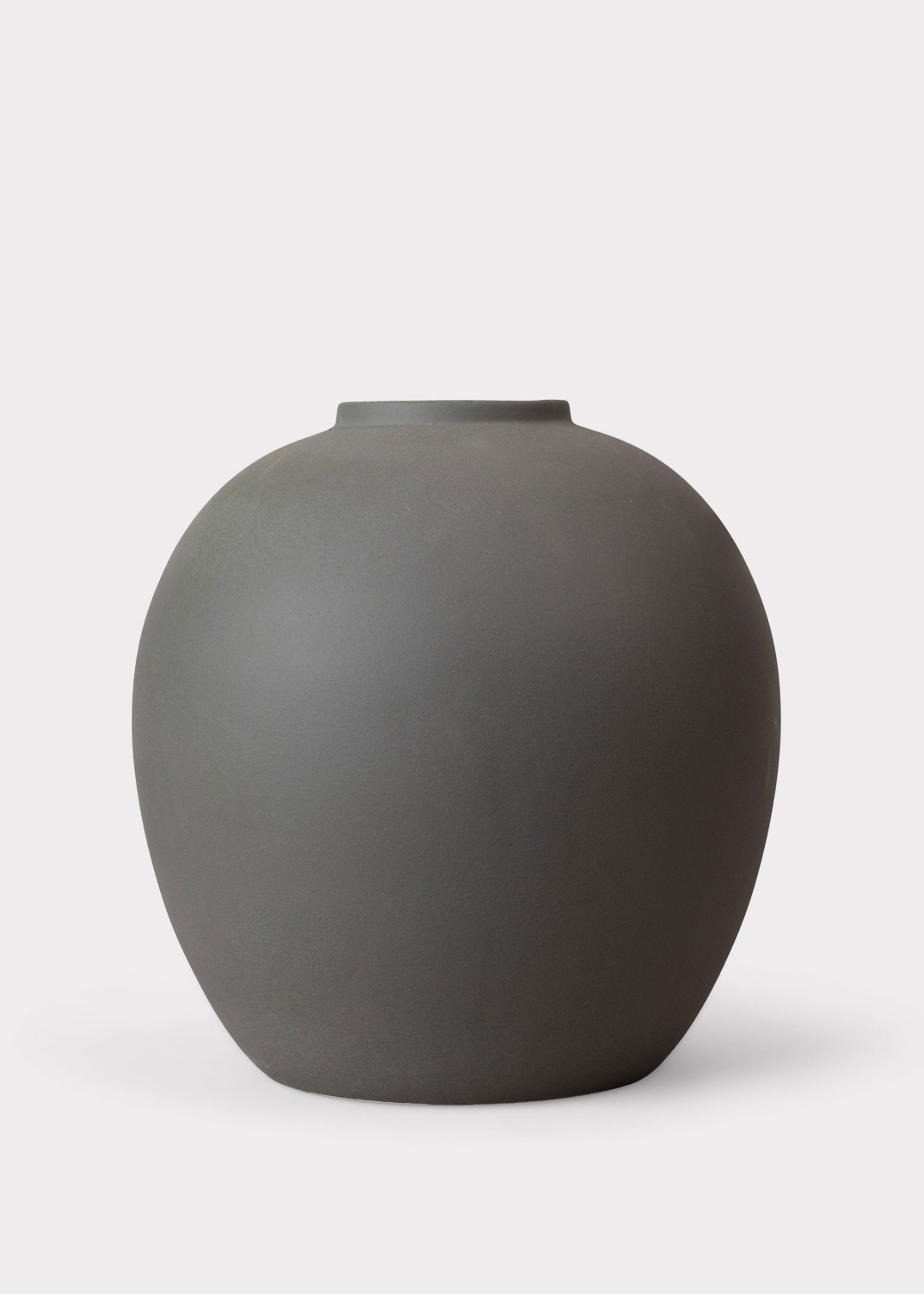 Dark ceramic vase with faux stems for living room decor