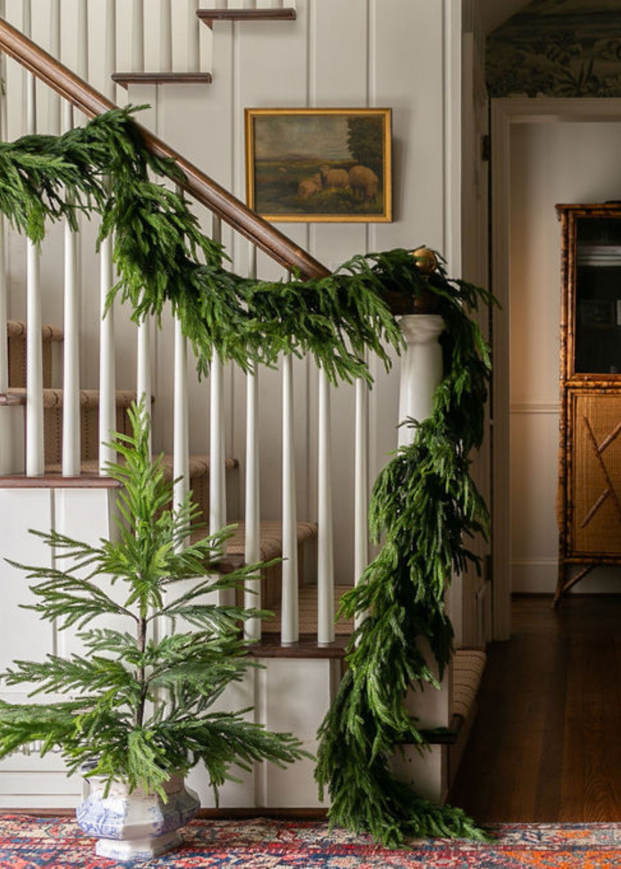 Potted faux Norfolk pine tree for entryway styling