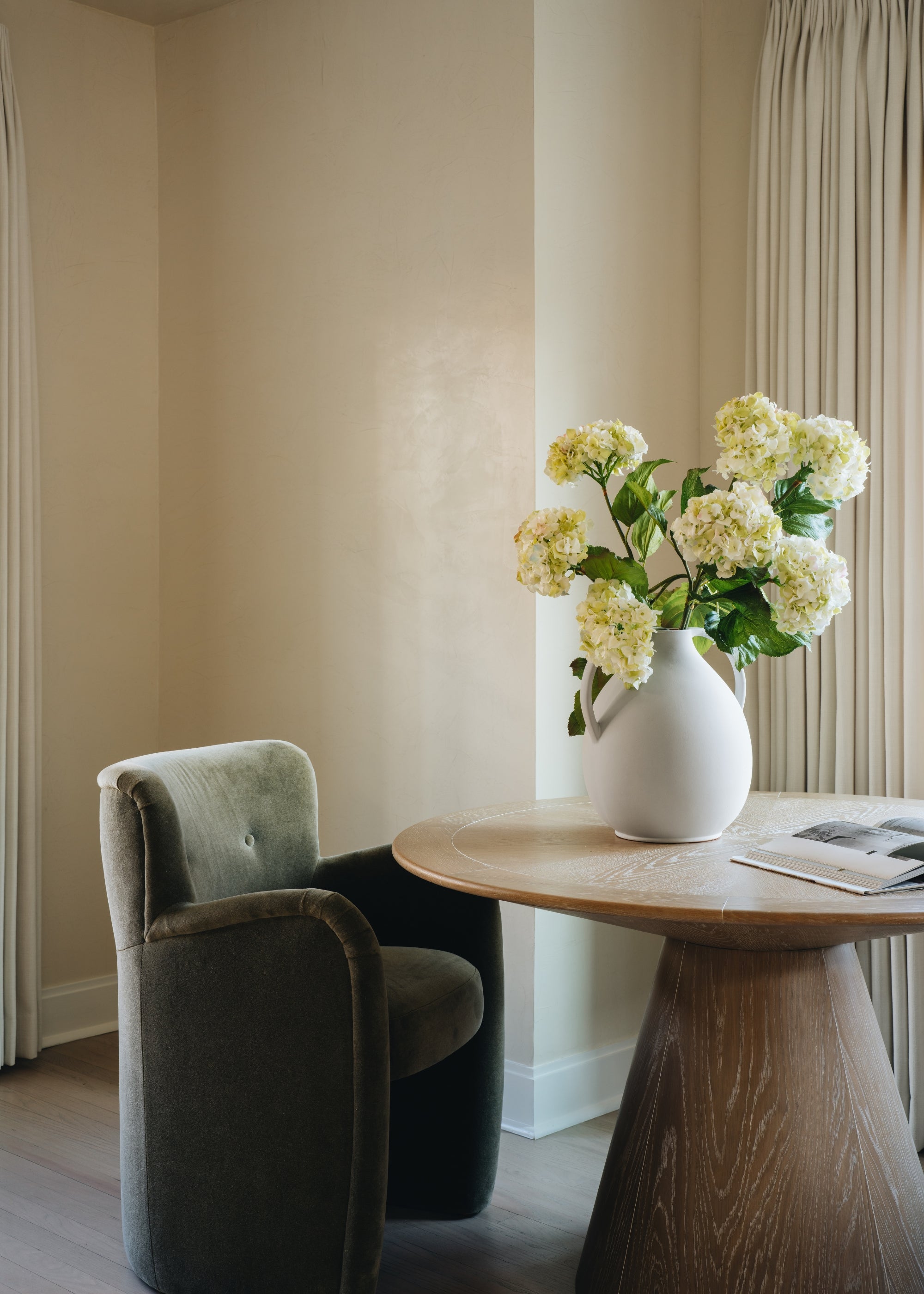 Cream clay vessel with branches for living room decor