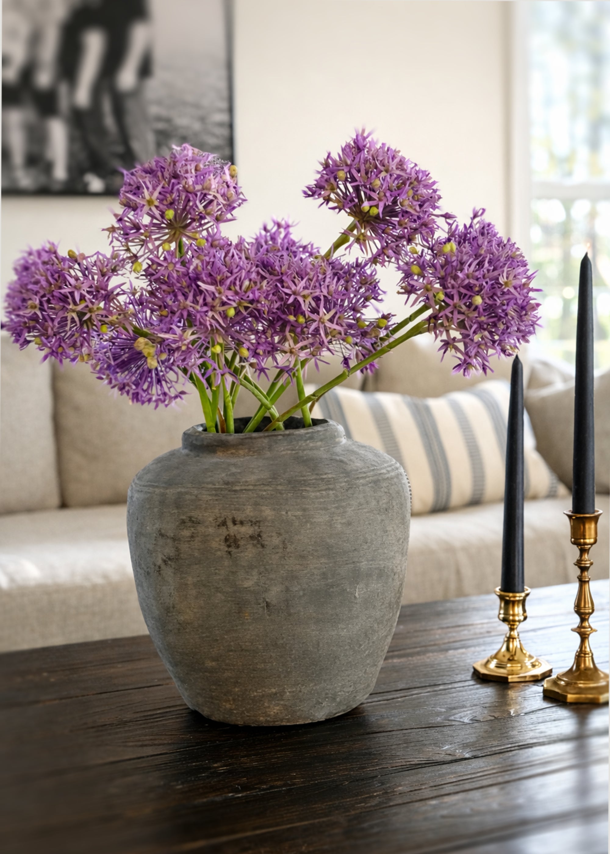 Purple faux allium flowers styled in tabletop arrangement