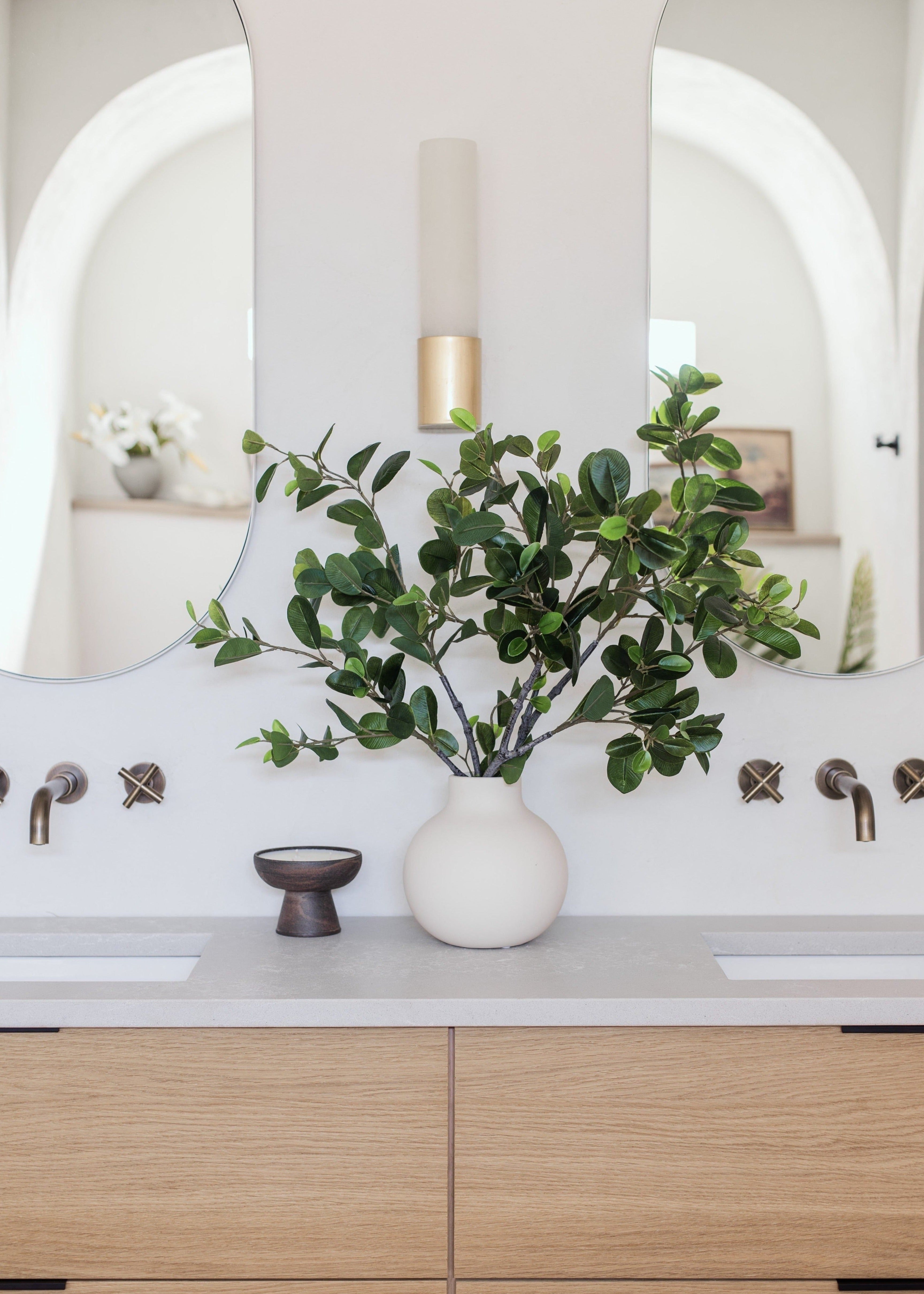 Round neutral vase for tabletop floral arrangement